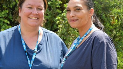 Two nurses outside smiling