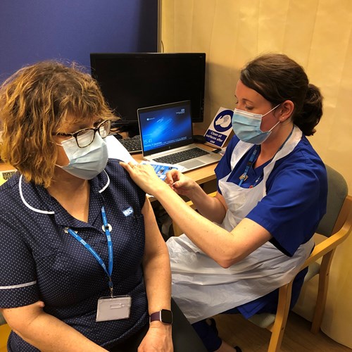 Pictue of our staff getting the COVID-19 vaccine