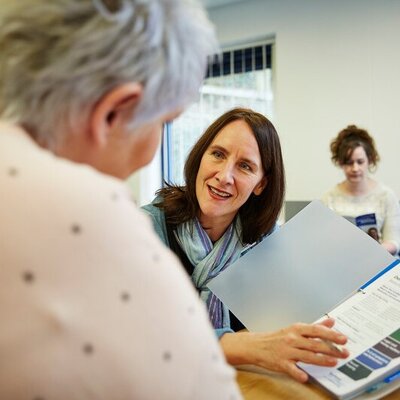 A picture of a carer and a patient