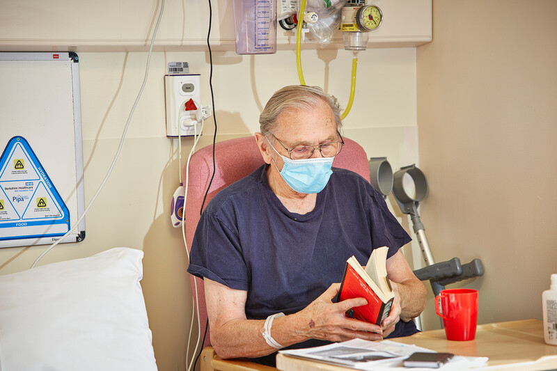 A patient reading a book