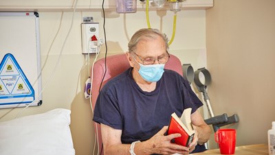 A patient reading a book