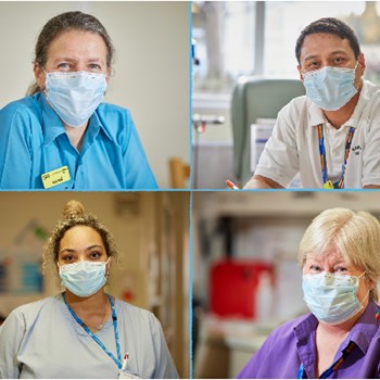 Photo of four clinicians smiling while working