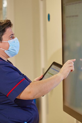 Image of a Nurse using a digital screen