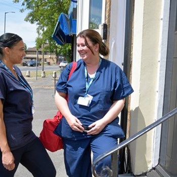 NHS workers outside building