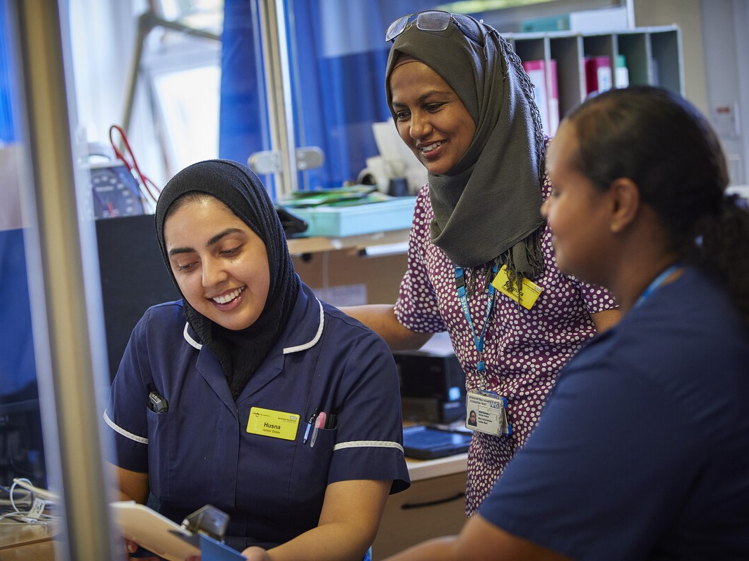 Three Berkshire Healthcare nurses talking to each other