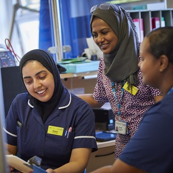 Three Berkshire Healthcare nurses talking to each other