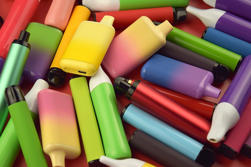 Pile of colourful disposable vapes