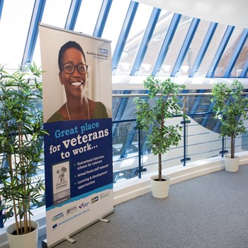 A picture of our veterans pop up banner in a hallway