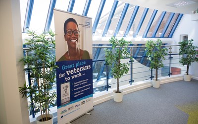 A picture of our veterans pop up banner in a hallway