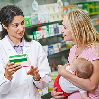 Pharmacist with woman and child