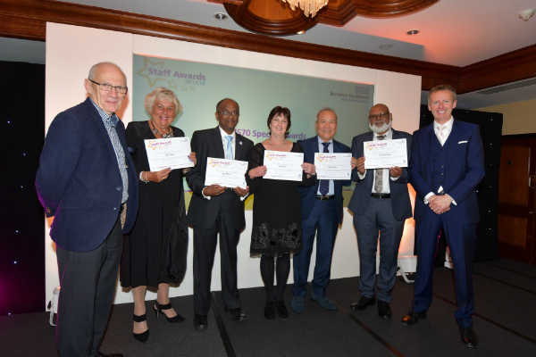 NHS 70 long service winners being presented their awards