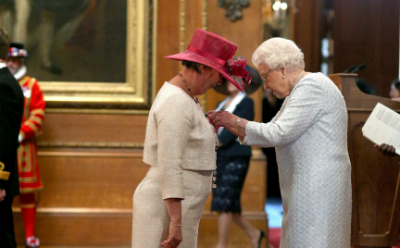 Alison Durrands receiving her MBE from the Her Majesty Queen