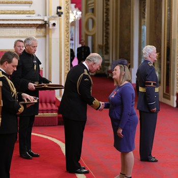 Rebecca Chester receiving her MBE from HRH the Prince of Wales at Buckingham Palace