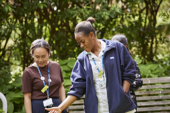 Two staff members standing outside
