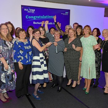 Linda shares the celebration with our health visiting team