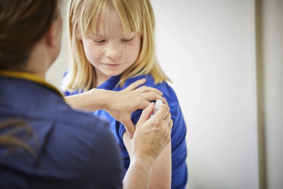 a child being vaccinated